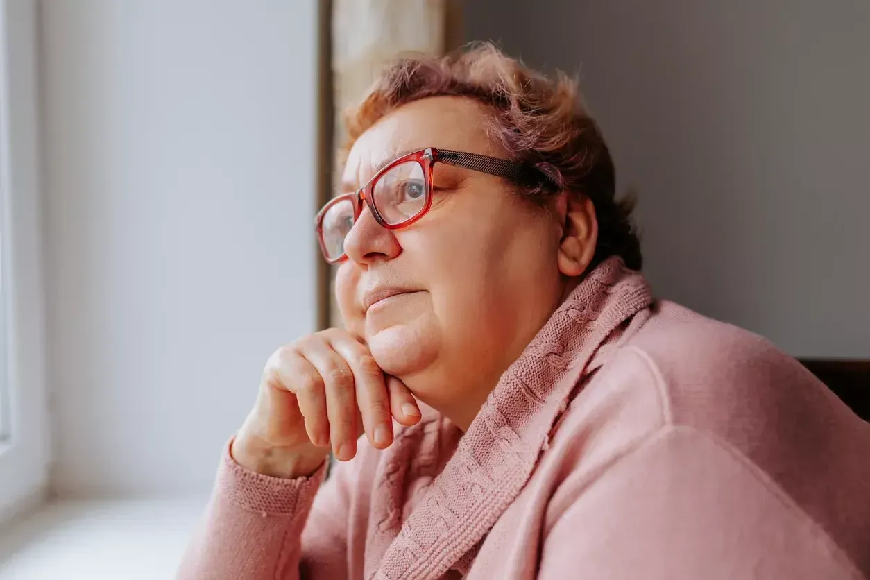 Woman looking out window